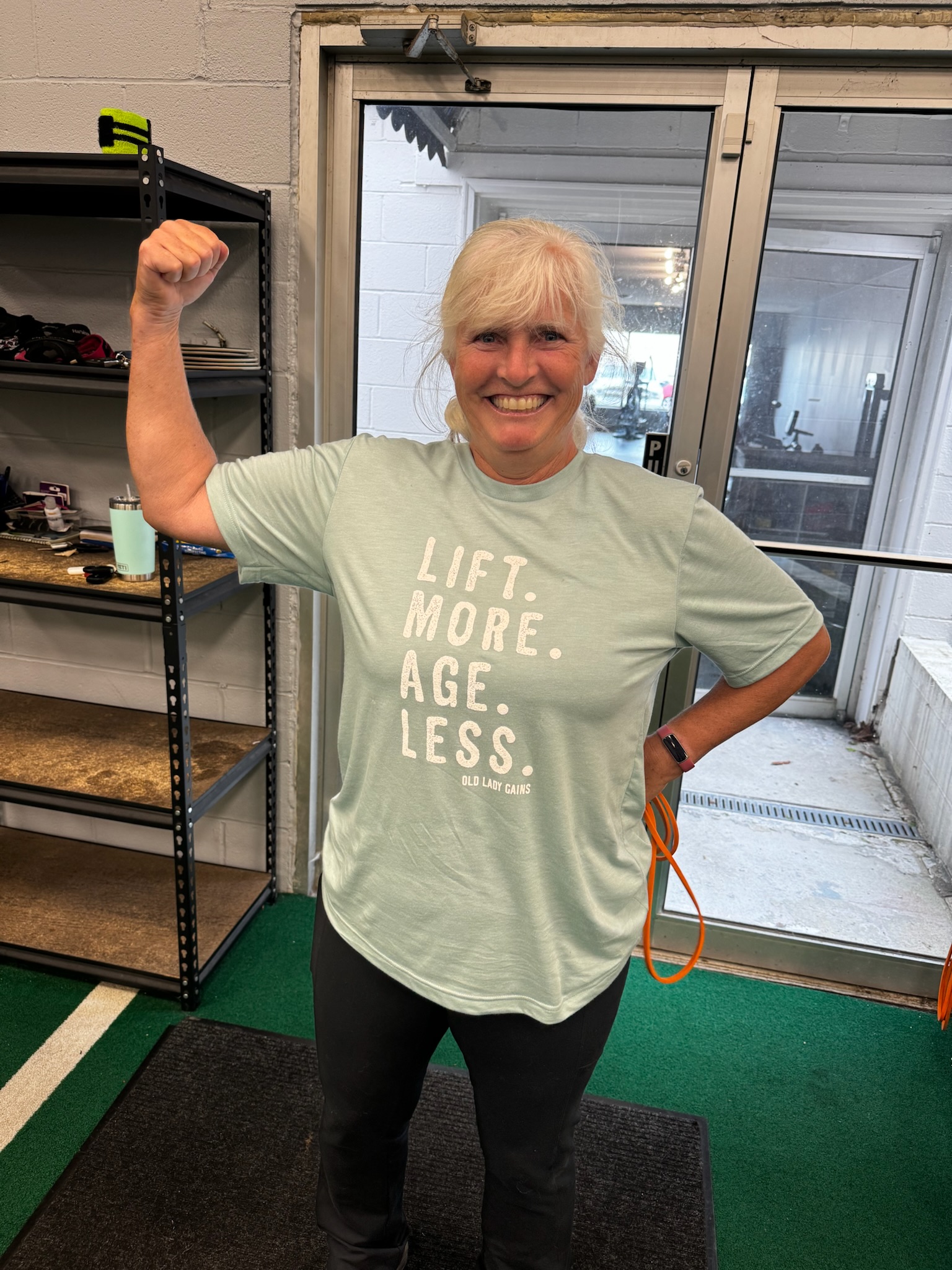 Woman Flexing Muscle - Stivers Strength Lexington, KY Strength training